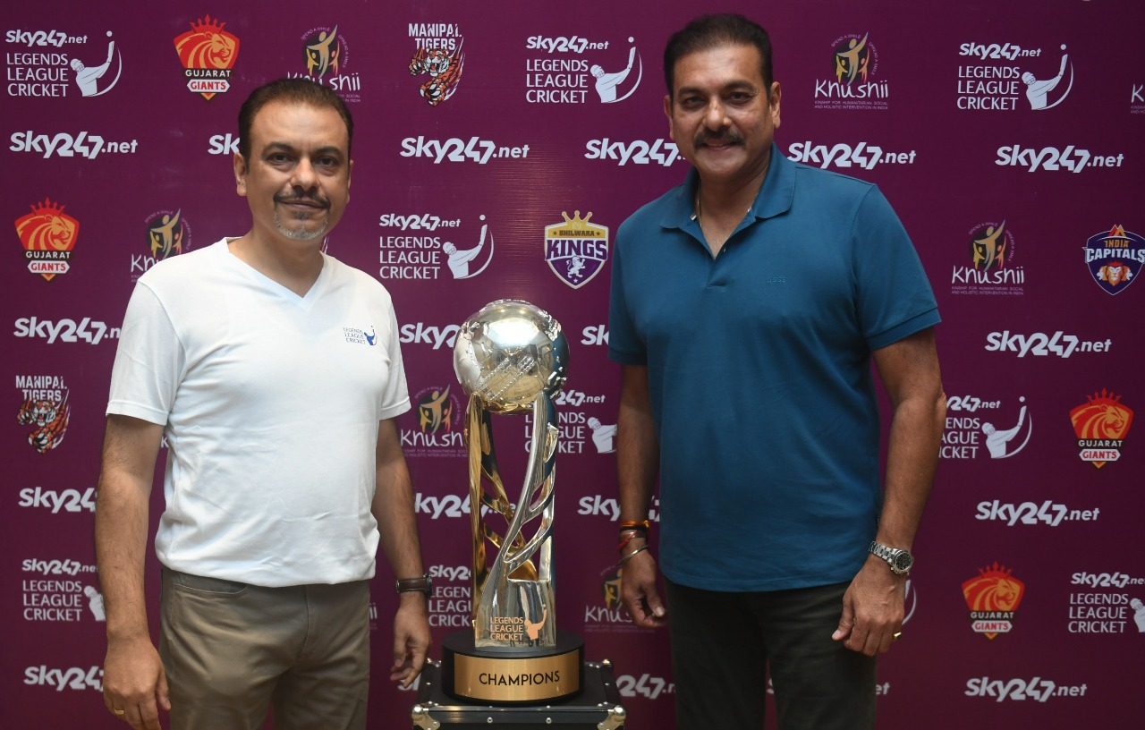 Caption: Legends League Cricket Co-founder & CEO Raman Raheja and Legends League Cricket Commissioner Ravi Shastri pose with the League trophy in Kolkata on Friday